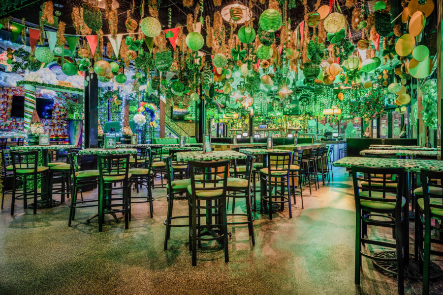 St. Patrick's Day decorations at a pop-up bar in Chicago creates green atmosphere and lighting.