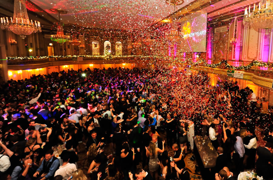 Party goers dance and have fun at thePalmer House Hilton New Year's Eve Soiree as confetti falls from the ceiling